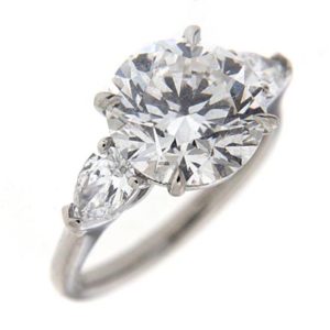 Round brilliant engagement ring with side stones