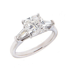 Cushion cut diamond engagement ring with trapezoid side stones