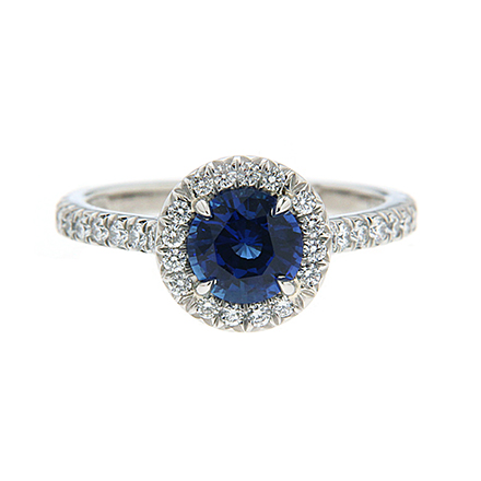 Love ring with a sapphire and diamonds all around